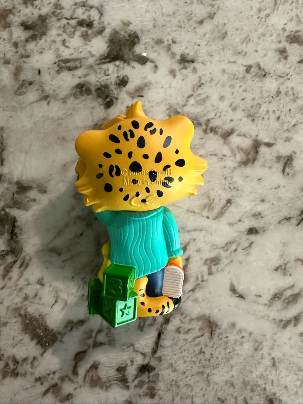 Yellow Tiger Tonies Figure with Teal Shirt and Green Brush